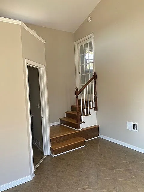 bonus room with .75 bath  tile floors, walk out to drive.